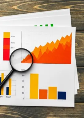 A marketing specialist analyzes the business plan for growth using traffic data put by graphs.