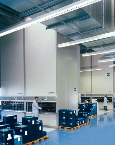 An organized and efficient warehouse is filled with neatly stacked shelves, ready for storage.